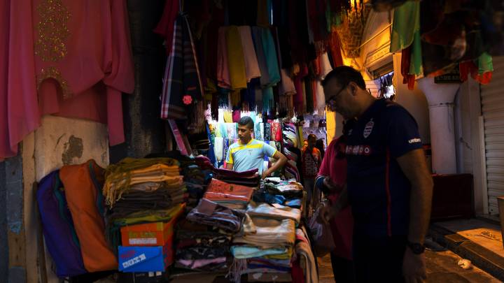A man examines wares in the souk in Tunis' old city. 