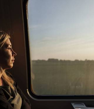 Lilas Hatahet, a Syrian refugee, journalist and separated mother of two boys, sits on the train on her way back home after finishing her work day in Copenhagen where she’s working as a Media Advisor.