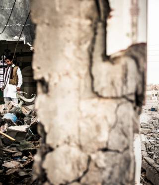 Abubaker in the ruins of the Sidi Alandalusi shrine, a significant icon of the city of Tajoura in the east of Tripoli.