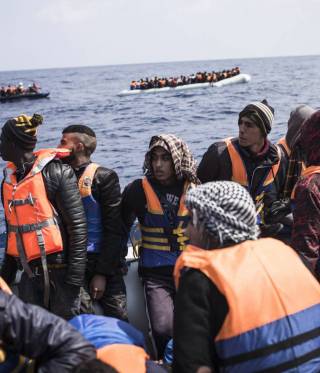Sea Crossing Since the summer of 2016, Libya has become the number one transit country for illegal migration into Europe. Here, a group of migrants who have been rescued by a MSF vessel.