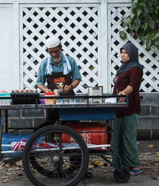 U Kyaw Thien at his stall U Kyaw Thien at his stall